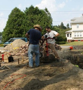 Dirt spraying from post hole auger