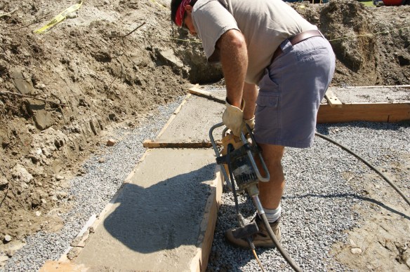 Thom using the concrete vibrator