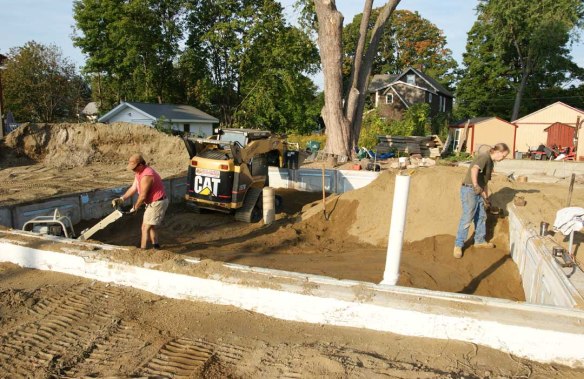 Skid steer in foundation pit