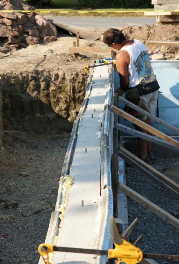 Thom puts the finishing touches on the last foam board of the day