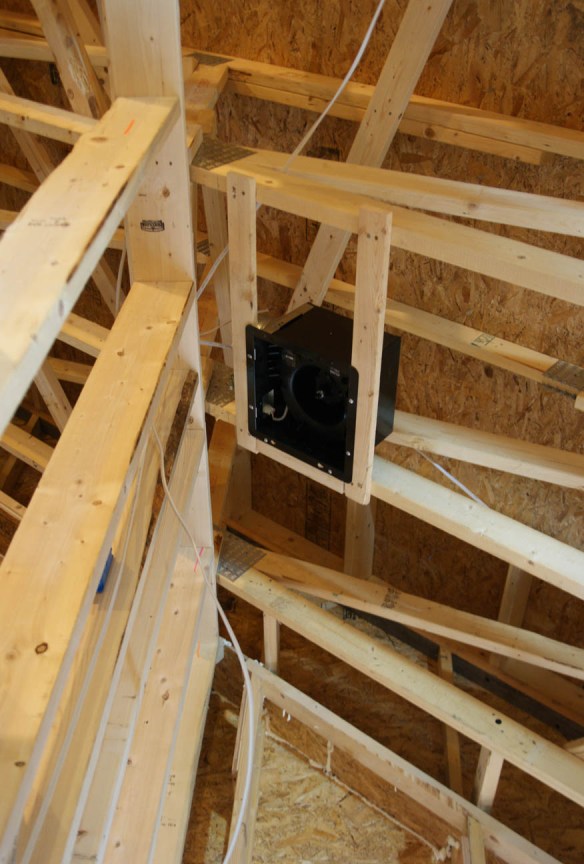 Bathroom fan mounted in ceiling