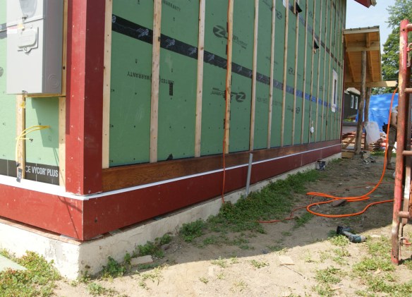 First course of siding goes on!