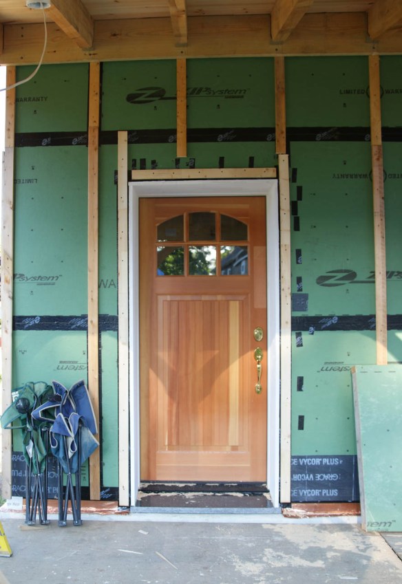 simpson bungalow solid fir door with brass thumb latch