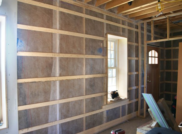 Netting and strapping first floor west wall