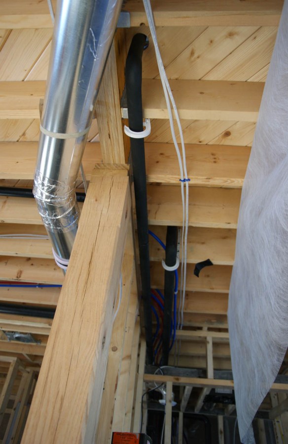 Solar hot water pipe runs along the first floor ceiling heading to the mechanical room