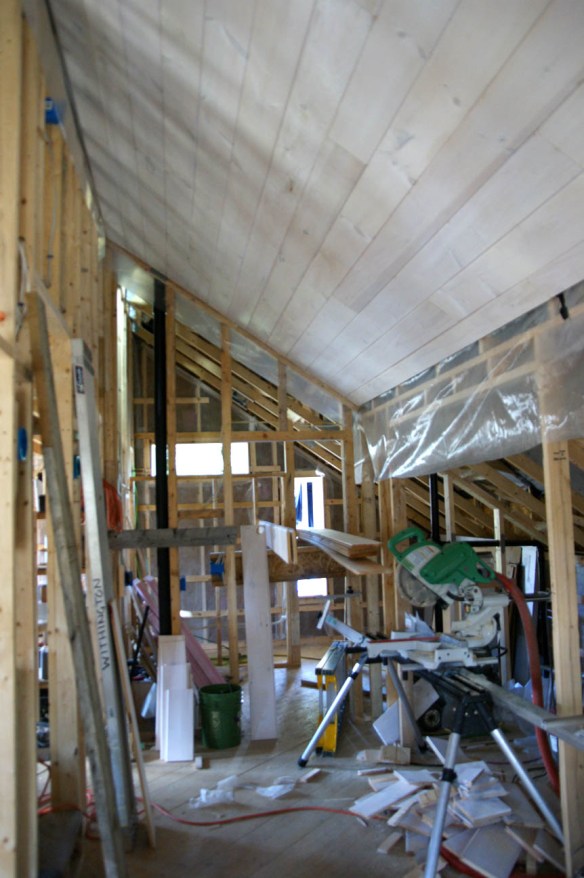 Tongue and groove knotty pine boards used for ceiling