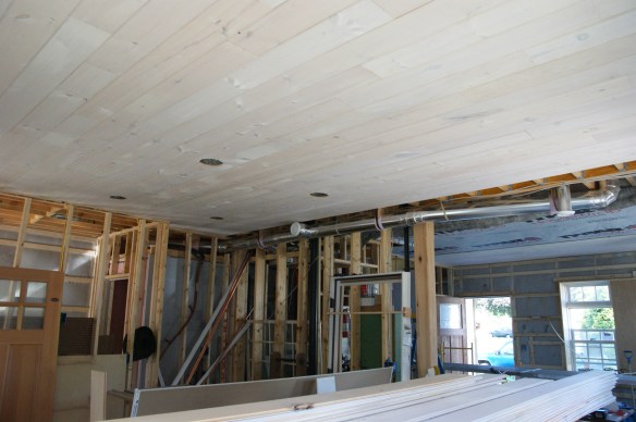 Tongue and groove knotty pine stained white for the ceiling