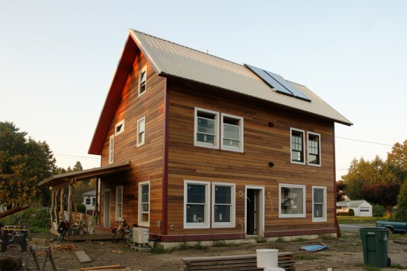 Saltbox house, red trim, clear red cedar siding, white roof