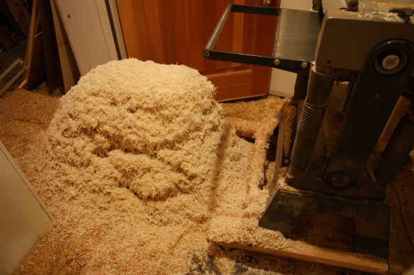 Huge pile of wood planer shavings and chips