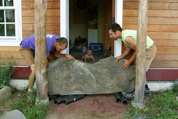 Stoop rock being moved into place