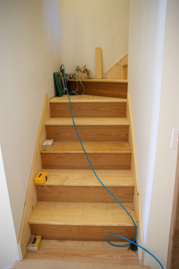 Working on the finish stairs to the third floor.